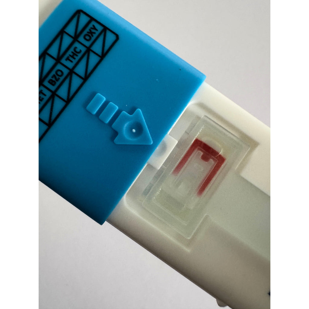 Saliva indicator showing adequate saliva collection on DrugCheckExpress Saliva Tracer 7 oral test kit